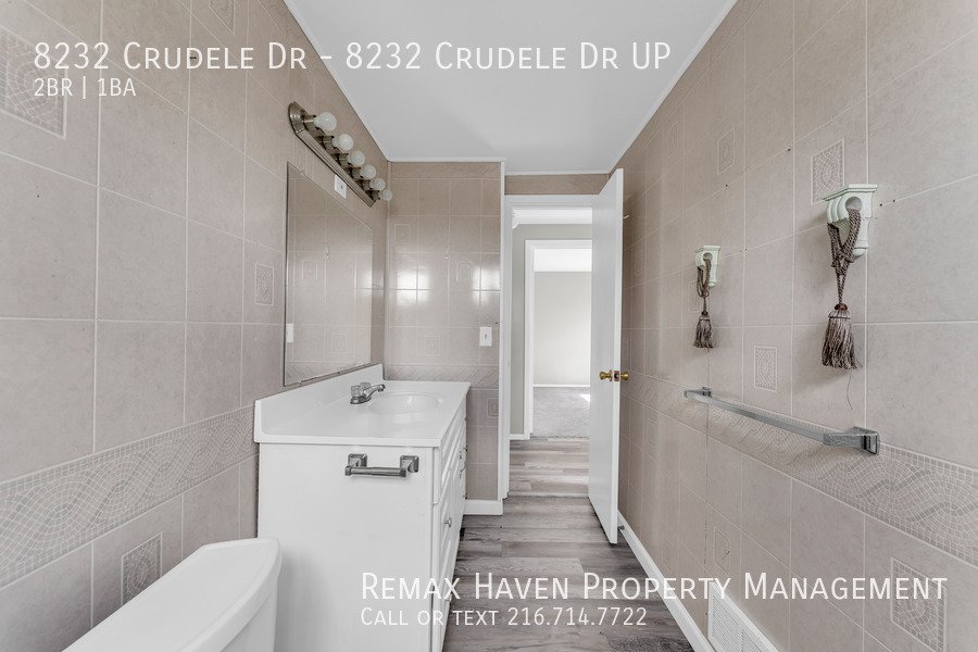 8232 Crudele Dr | UP, Garfield Heights- Spacious 2-bed 1-bath multi-fa property image