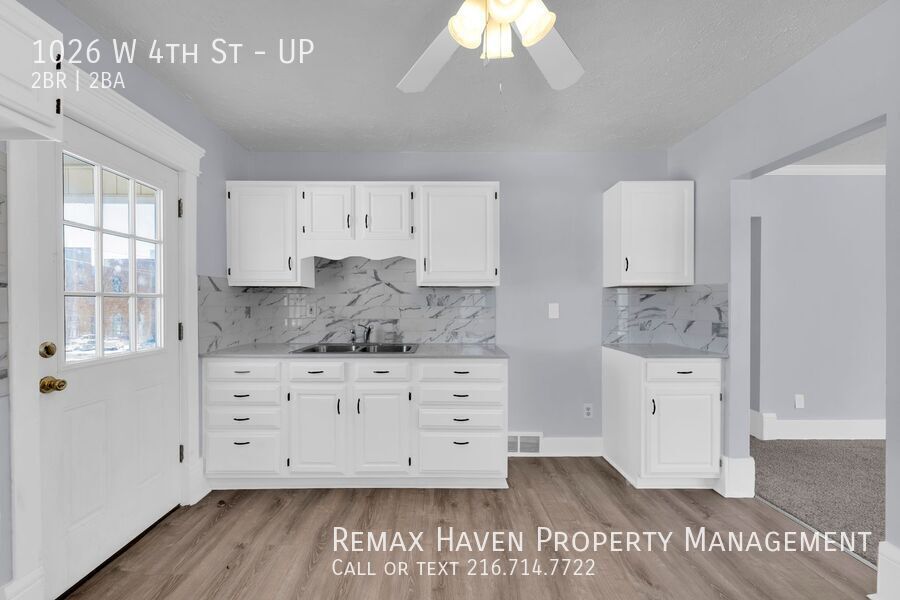 1026 W 4th St | UP, Lorain - Spacious 2-bed 1.5-bath multi-family home!  property image